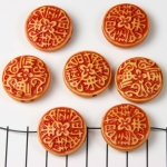 plat rond met tekeningen - oranje bruin