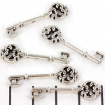 key decorated 30 mm - old silver